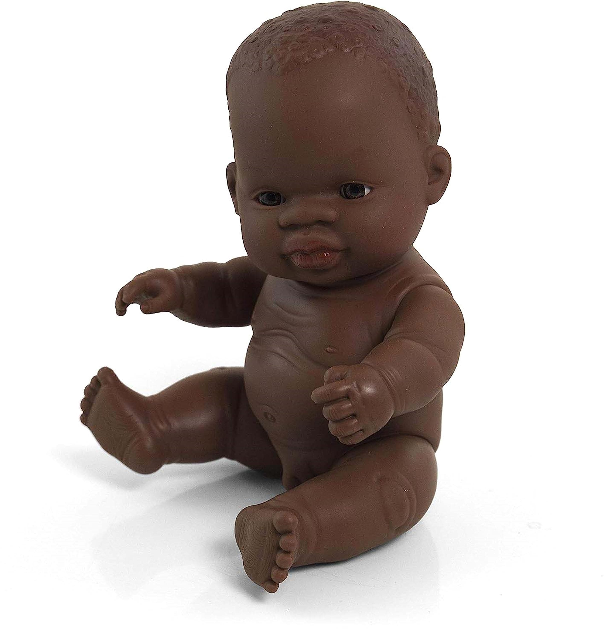 Miniland African boy doll without underwear in bag is soft vinyl, resilient and flexible. 21cm