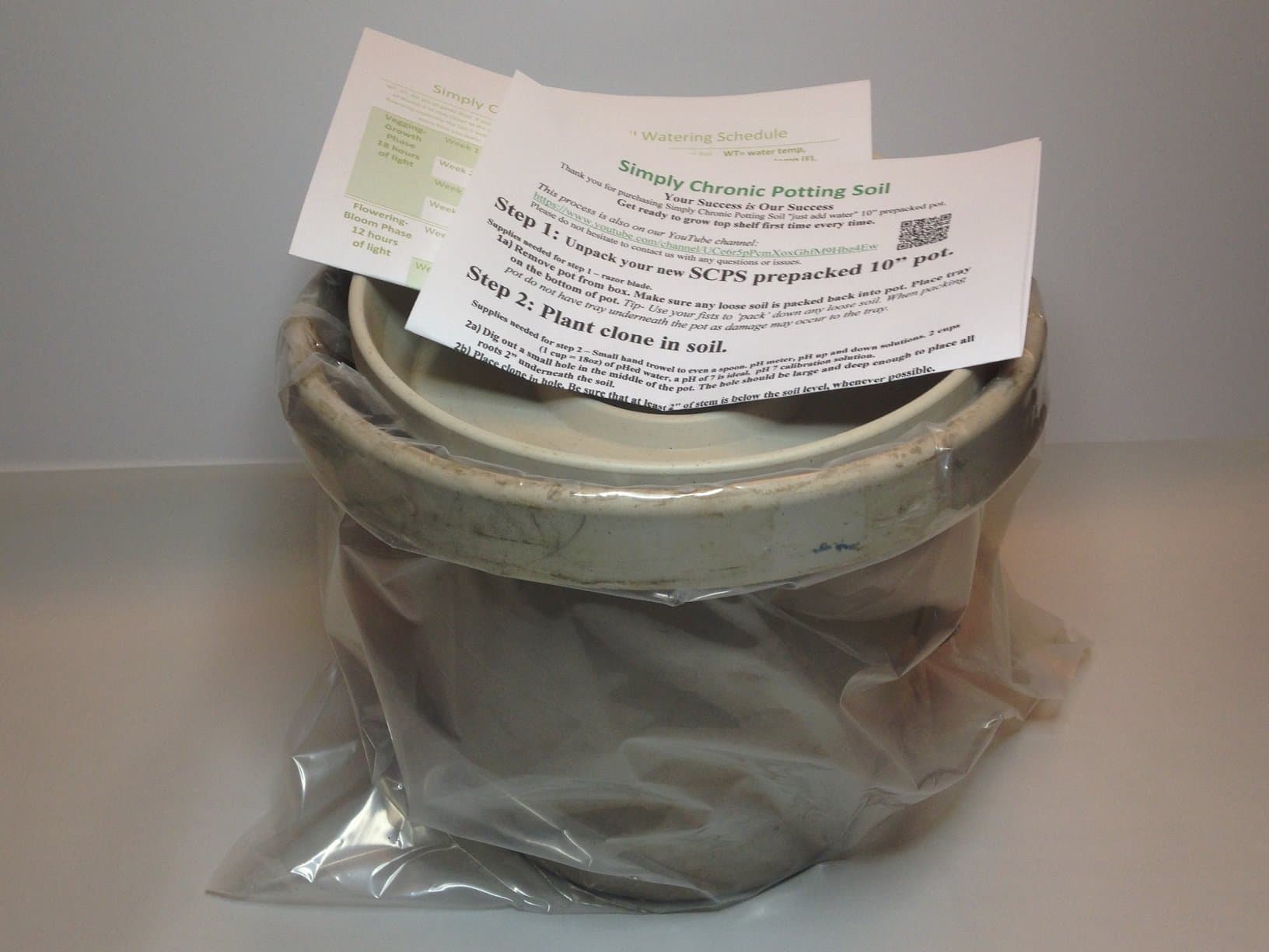 10" prepacked pot of soil