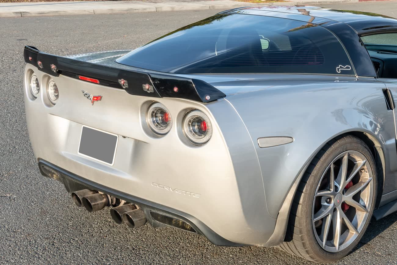 for 2005-2013 Chevrolet Corvette C6 | C6.5 Style Rear Trunk Lid Wing Spoiler WickerBill with Plug & Play Third Brake Light (Glossy Black with Smoke Tinted WickerBill)