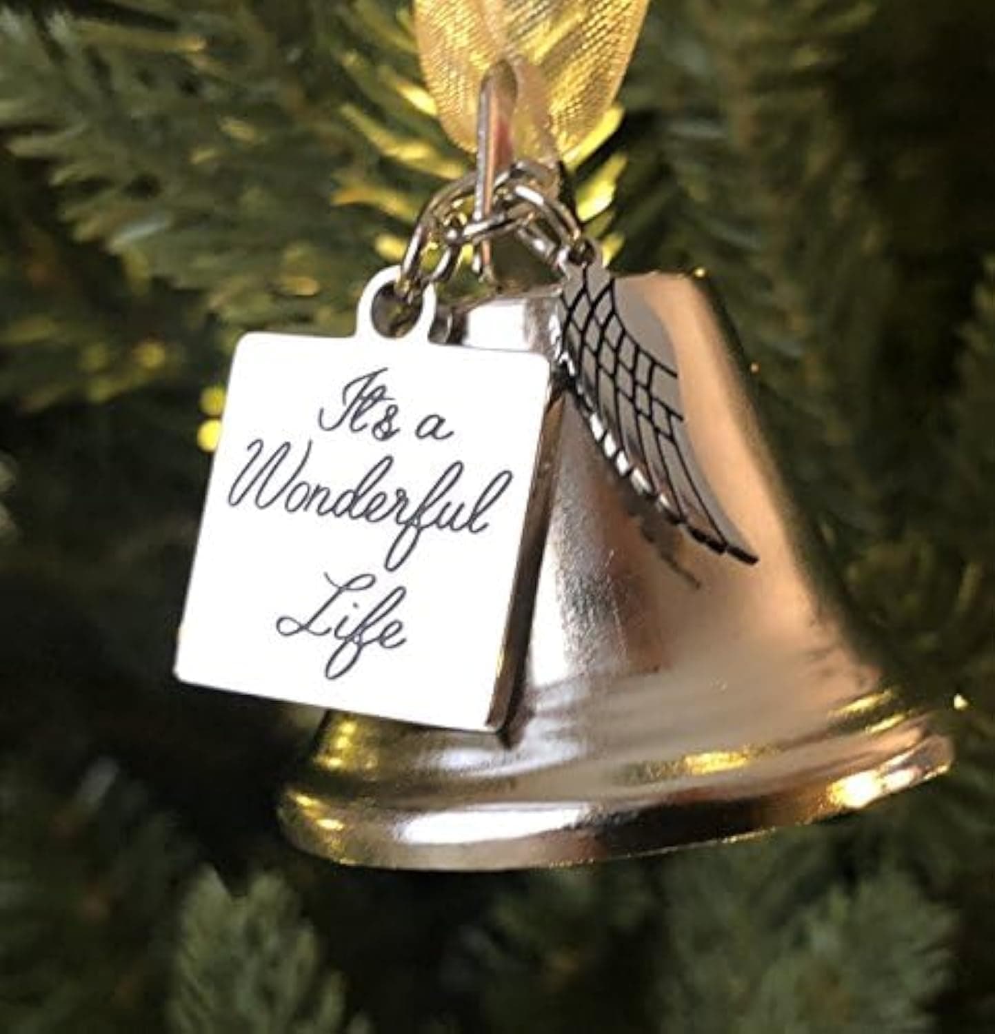 - It's a Wonderful Life Inspired Christmas Angel Bell Ornament with Stainless Steel Angel Wing Charm. New Larger Size and Now Comes with 2 Interchangeable Ribbons. (Stainless Steel)