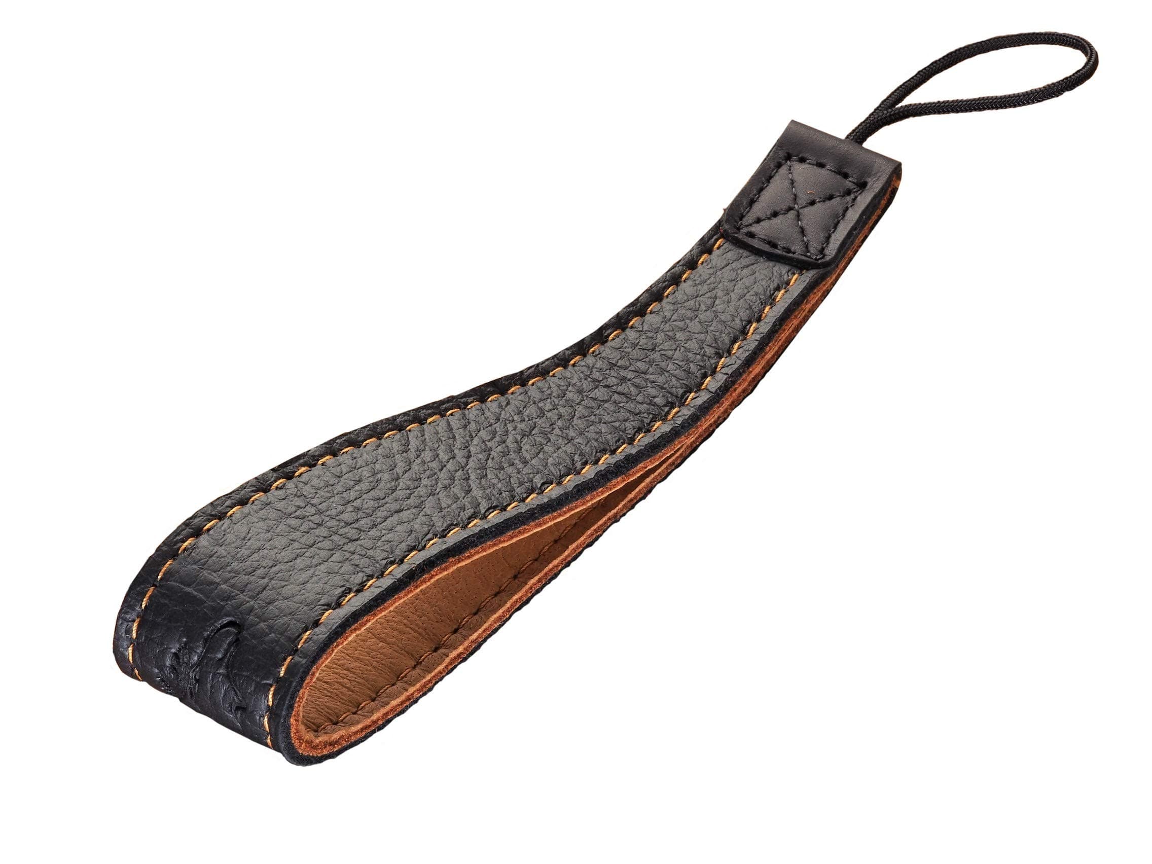 1302 SLiNG-1 Wrist Strap Black/Natural/Contrast Stitching Made from Soft Durable Elk Leather Unique wearing comfort. Universal size for all camera types, from small compact to large SLR cameras up to max. 3 kg weight. Includes adapter strap for small eyelets. Made in Germany.
