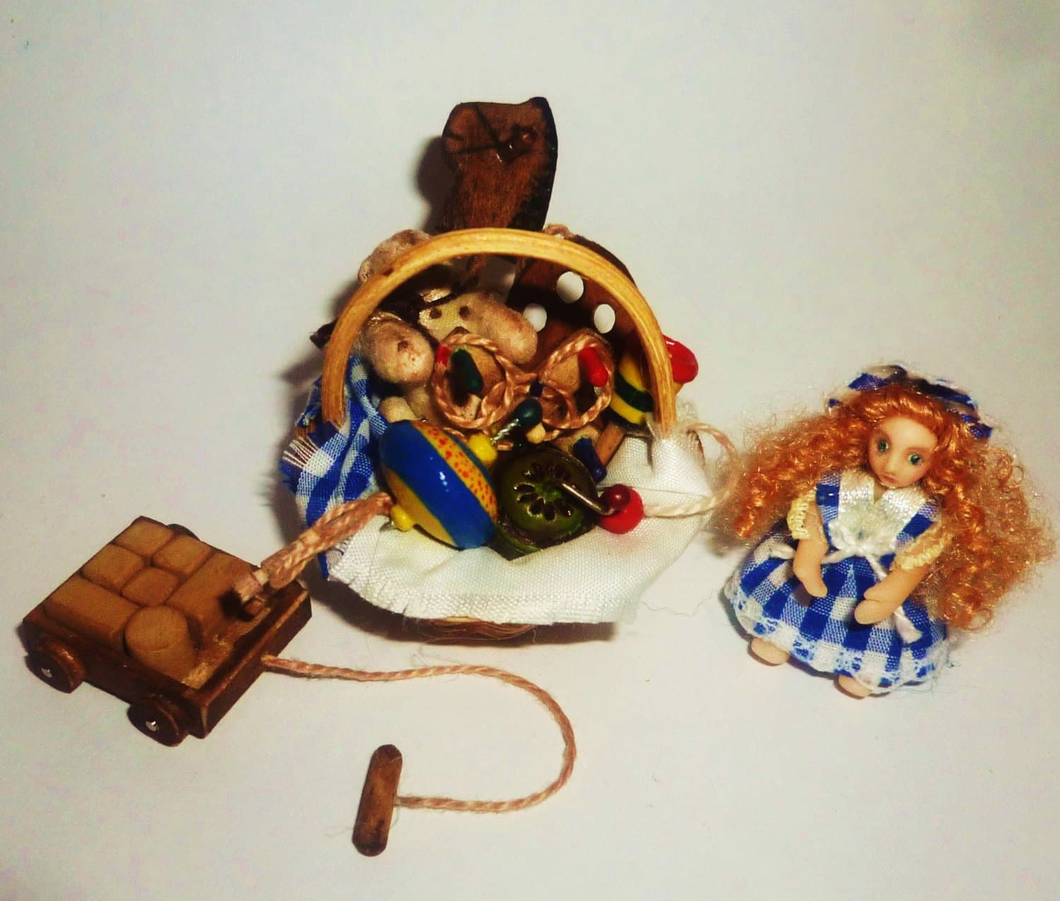 Wicker Basket with Victorian toys. Dollhouse miniature 1:12