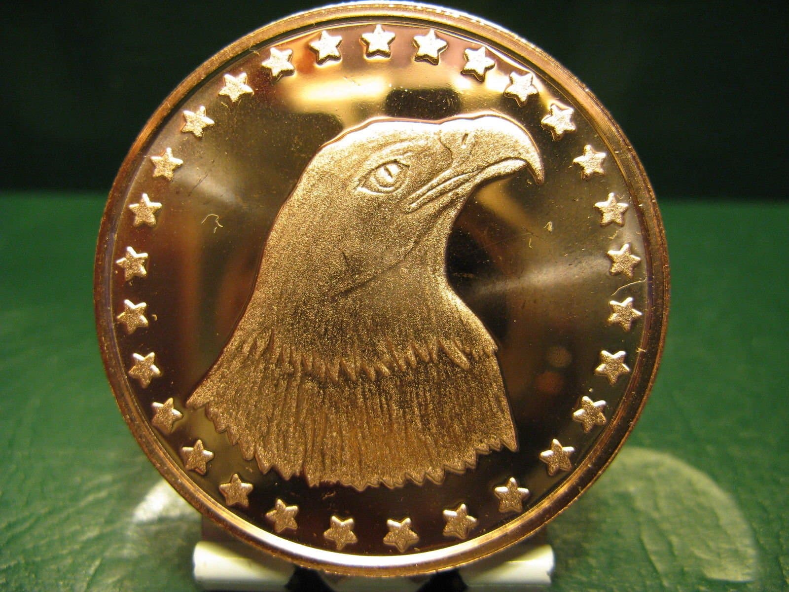 KWG Bald Eagle , 1 oz fine copper 39 mm rounds, has some very fine ( almost invisible) scratches but otherwise in very nice bright condition . supplied in BCW vinyl coin pocket